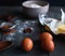 Close-up of ingredients for chocolate brownies on dark background