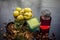 Close up of ingredients of treatment for oily skin on wooden surface i.e. amla powder with some raw organic rose water in a glass