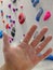 Close up of injured male boulder hand with magnesium in front of boulder wall