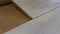 Close up installing timber laminate floor on cork base. Wooden floors house renovation