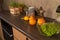 Close-up of interior design kitchen. Modern domestic dark interior of kitchen cabinets with cookware.