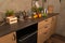 Close-up of interior design kitchen. Modern domestic dark interior of kitchen cabinets with cookware.