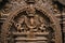 close-up of intricate carving on hindu temple door