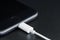 Close-up iPhone 7 matte black connect to usb cable