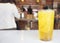 Close up isolated Chrysanthemum ice tea glass on table in chinese restaurant have copyspace , yellow herbal water for drink