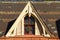 Close up isolated image of an arched Palladian style dormer window on the roof of a colonial era house