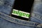 Close up of isolated mobile phone with payment provider Adyen logo lettering in jeans pocket