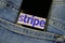 Close up of isolated mobile phone with payment provider Stripe logo lettering in jeans pocket