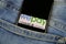 Close up of isolated mobile phone with payment provider Wepay logo lettering in jeans pocket