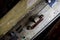 Close up of isolated old used suitcase with rivets, leather grip and combination locks