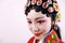 Close-up isolated white background Beijing opera Chinese female actress woman makeup comb hair with traditional headwear costume