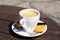 Close up of isolated white espresso cup with saucer, spoon and sweet cookie