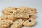 Close up Italian biscotti cookies on baking paper. Fresh baked cookies with nuts and dried cranberries with selective focus. Copy