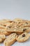 Close up Italian biscotti cookies on baking paper. Fresh baked cookies with nuts and dried cranberries with selective focus. Verti