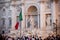 Close Up of Italian Flag on the Blurred Trevi`s Funtain Background