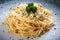 Close up Italian pasta with cheese and black pepper