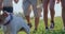 Close up of jack russel terrier being led by tourists, going forward, walking in hills, enjoying sunny weather. Kids