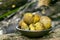 Close up of Jamur So, Melinjo, Common Earthball, Scleroderma aurantium, mushrooms growing around the Gnetum gnemon plant