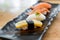 Close up of japanese cuisines nigiri sushi set on black plate se