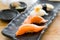 Close up of japanese cuisines nigiri sushi set on black plate se