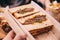 Close up of Japanese medium rare Wagyu sandwich served in wooden box