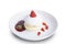 Close-up of Japanese-style pancakes, decorated with plates with fruit faces, strawberries isolated on white background