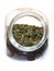 Close up jar with lovage spice isolated