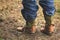 Close up jeans stuffed into cowboy boots