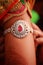 Close-up of jewelery on hands of Indian bride