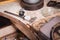 Close-up of jewelry production equipment on a table background. Goldsmith profession. Retro jeweler set.