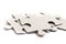 Close-up on jigsaw puzzle pieces, blank white paper jigsaw puzzle elements linked together and separate