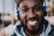 Close up of joyful afro american man wearing headphones