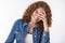 Close-up joyful positive smiling attractive young redhead woman with freckles pimples tilting head laughing carefree