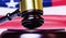 Close up judge gavel against United States national flag. Judicial system of the USA, justice, equity, law and human freedom