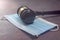 Close-up of a Judge Gavel Resting On A Protective Mask.