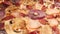 Close-up juicy Italian pizza. Warm lighting and camera slow motion.