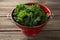 Close-up of kale in colander on table