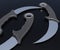 close up karambit knifes in the black background