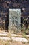 Close up of khachkar, covered with lichen, located on the bank of Sevan Lake, on cemetery of Hayravank Monastery, Armenia.