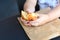 Close up kid hands holding croissant.