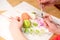 Close up of kid ` s hand holding an ester egg during painting. Happy ester concept