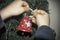 A close-up of kids hands with a Christmas ornament