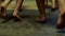 Close up for kids legs running barefoot on yellow mat, rear view. Scene. Children legs running indoors without shoes on