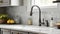 A close-up of a kitchen sink featuring grey cabinets, a white marble countertop, backsplash, and accents