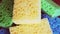 Close-up of kitchen sponge surface 4K footage. Several colorful sponges, 4k macro video, rotation