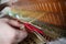 Close up of knot mat with woman hand on woven mat