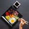 Close-up of Korean dish, with variety of appetizers with vegetables and eggs. Diet. bibimbap. Top view. Round plate