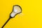 Close-Up Of Lacrosse Equipment On Yellow Background. Lacross is a team sport