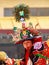 Close-up of lama in ritual costume and ornate hat performs a historical religious mystery Black Hat Dance of Tibetan Buddhism on