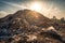 close-up of a landfill's towering pile of waste, with the sun shining down on it